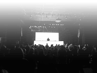 a black and white photo of a crowd at a concert